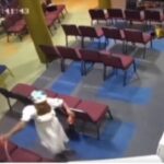 Woman caught on CCTV setting Alpha Hour Auditorium ablaze